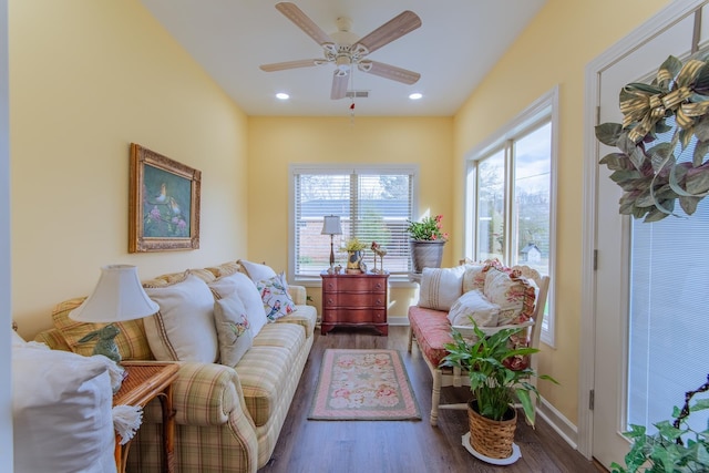 living area featuring baseboards, wood finished floors, recessed lighting, and a ceiling fan