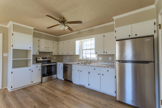 kitchen featuring a sink, appliances with stainless steel finishes, under cabinet range hood, white cabinets, and ceiling fan