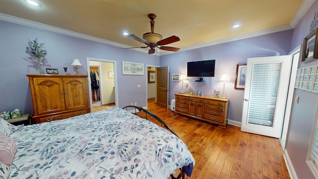 100 Carefree Ln, Counce, TN 38326 - bedroom featuring recessed lighting, light wood-type flooring, crown molding, baseboards, and a spacious closet