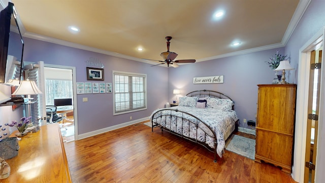 100 Carefree Ln, Counce, TN 38326 - bedroom with hardwood / wood-style floors, crown molding, recessed lighting, and baseboards