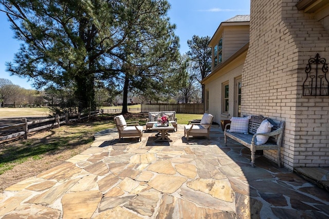 view of patio featuring a fenced backyard and an outdoor living space