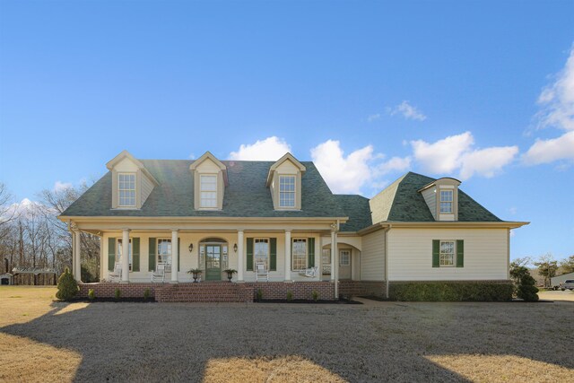 5460 Old Jackson Rd, Somerville, TN 38068 - cape cod home with covered porch and a front yard