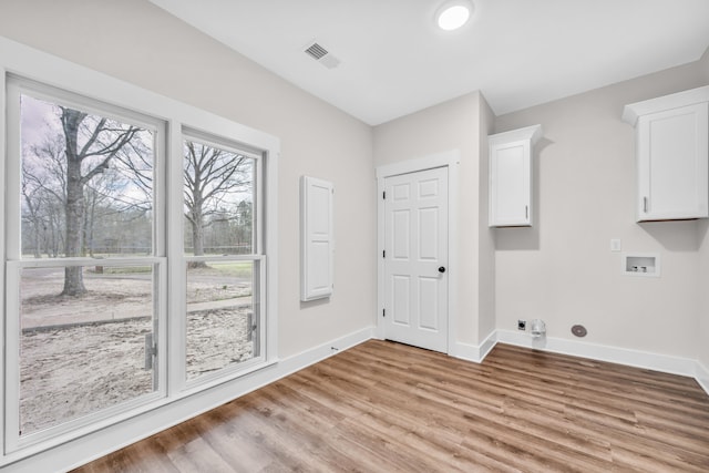 laundry room with baseboards, visible vents, washer hookup, and electric dryer hookup