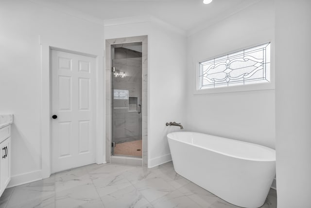 bathroom with crown molding, a shower stall, marble finish floor, a freestanding tub, and vanity