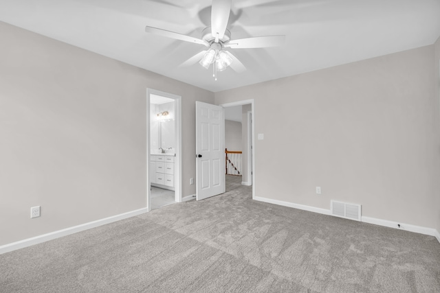 unfurnished bedroom featuring carpet flooring, baseboards, and visible vents
