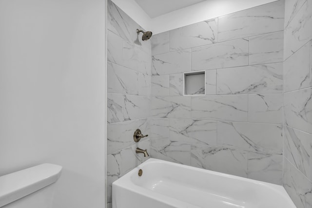 bathroom with toilet and washtub / shower combination