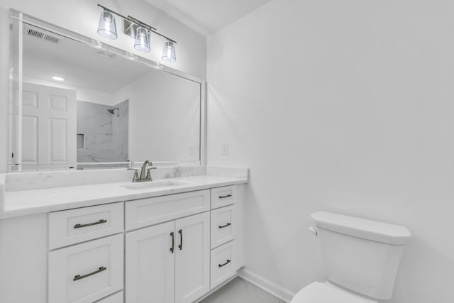 bathroom featuring visible vents, a shower, marble finish floor, toilet, and vanity