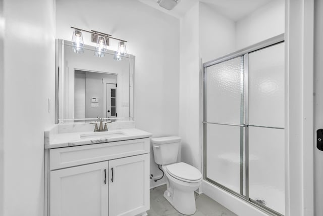 full bath with vanity, marble finish floor, toilet, and a shower stall