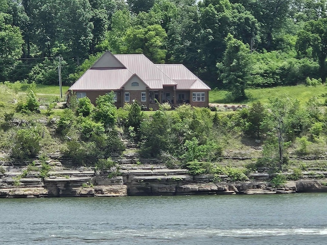 property view of water featuring a wooded view