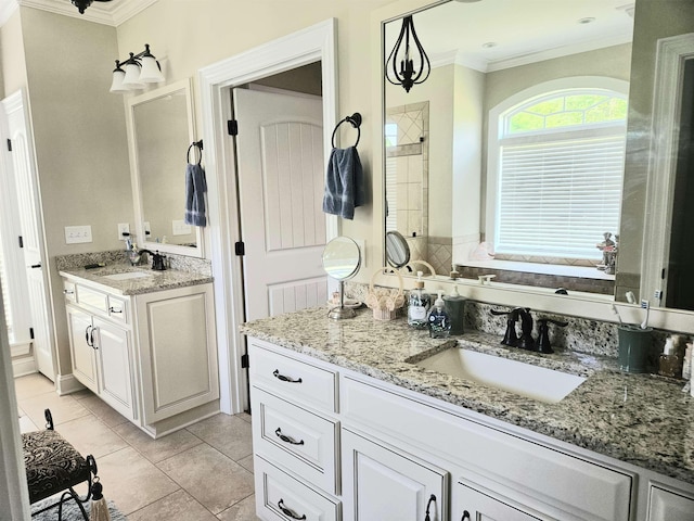 bathroom featuring crown molding, a sink, and two vanities