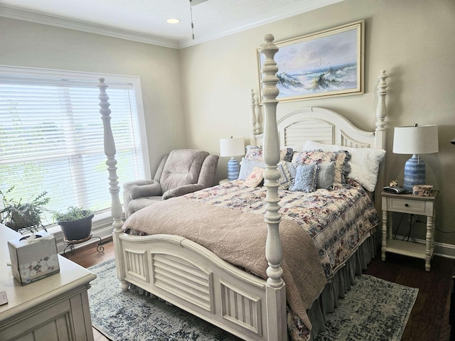 bedroom featuring multiple windows, baseboards, ornamental molding, and dark wood-style flooring