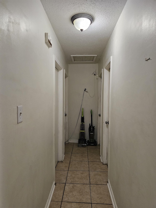 3240 Mario St, Memphis, TN 38127 - hallway featuring a textured ceiling, visible vents, baseboards, and light tile patterned floors