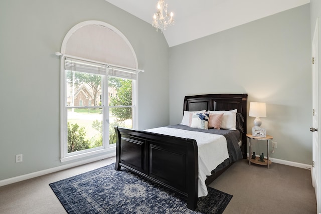carpeted bedroom with a notable chandelier, baseboards, and lofted ceiling