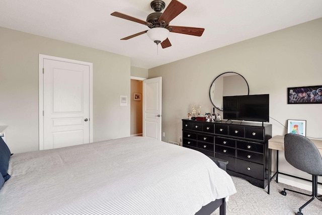 carpeted bedroom with ceiling fan