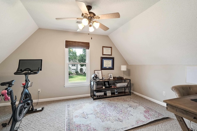 workout room featuring carpet flooring, lofted ceiling, and a ceiling fan