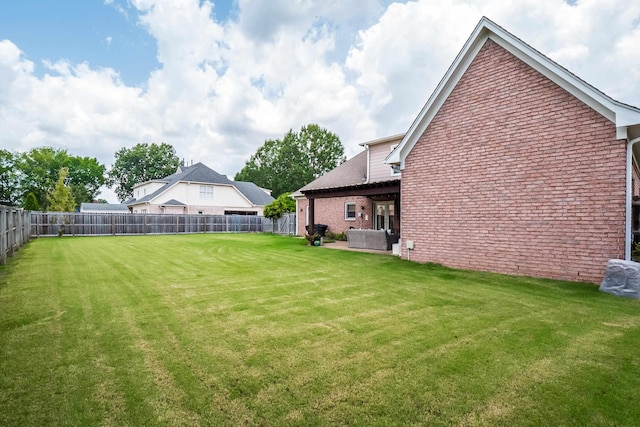 view of yard featuring a fenced backyard and a patio