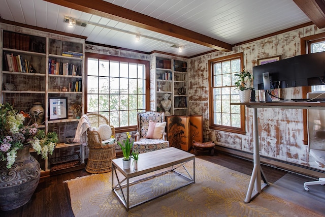 living area featuring hardwood / wood-style floors, wallpapered walls, beamed ceiling, and baseboard heating