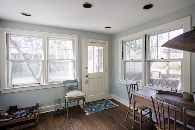 entryway featuring dark wood-type flooring, baseboards, recessed lighting, and plenty of natural light