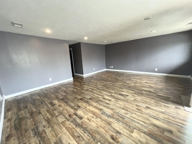 29 Wardlow St, Gates, TN 38037 - unfurnished room featuring baseboards, recessed lighting, visible vents, and dark wood-type flooring