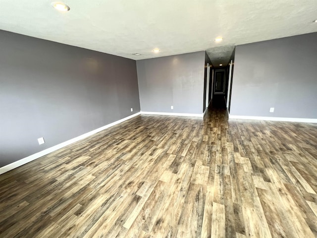 29 Wardlow St, Gates, TN 38037 - empty room featuring dark wood-type flooring, baseboards, and recessed lighting