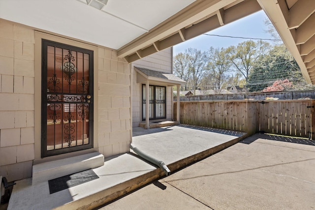 view of patio / terrace featuring fence
