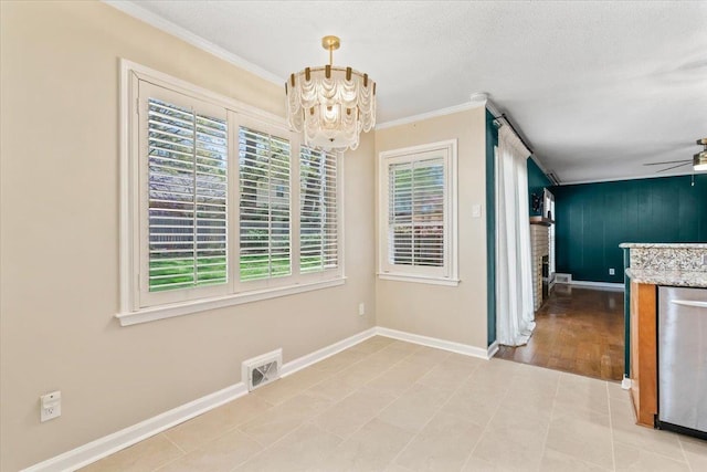 2060 Abergeldie Dr, Memphis, TN 38119 - unfurnished dining area featuring a textured ceiling, visible vents, baseboards, ornamental molding, and ceiling fan with notable chandelier