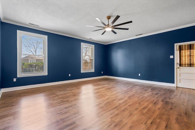 2060 Abergeldie Dr, Memphis, TN 38119 - unfurnished room with visible vents, wood finished floors, ornamental molding, and a ceiling fan