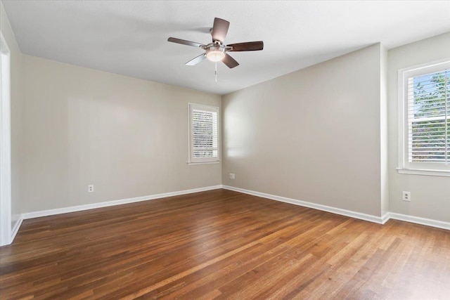 2060 Abergeldie Dr, Memphis, TN 38119 - unfurnished room featuring baseboards, a wealth of natural light, wood finished floors, and a ceiling fan
