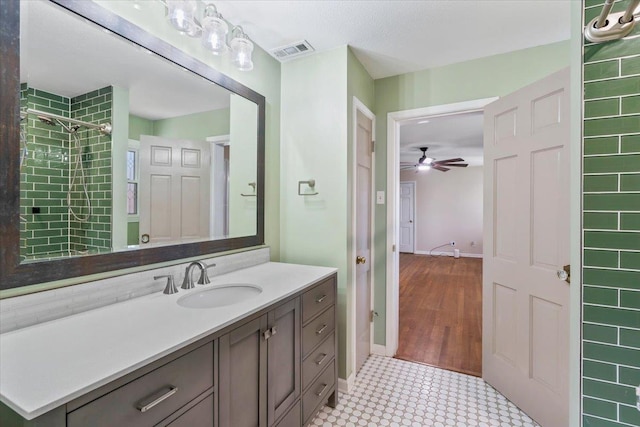 2060 Abergeldie Dr, Memphis, TN 38119 - bathroom with baseboards, a ceiling fan, visible vents, and vanity