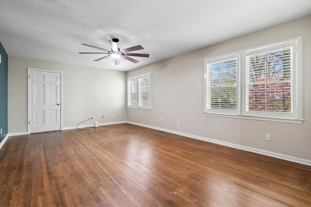 2060 Abergeldie Dr, Memphis, TN 38119 - unfurnished room featuring a textured ceiling, baseboards, wood finished floors, and a ceiling fan