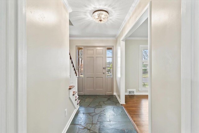 2060 Abergeldie Dr, Memphis, TN 38119 - foyer featuring ornamental molding, baseboards, a notable chandelier, and visible vents