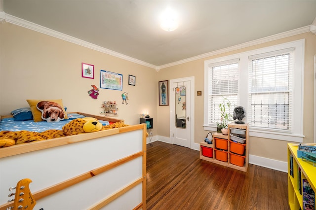 bedroom with crown molding, baseboards, and dark wood finished floors