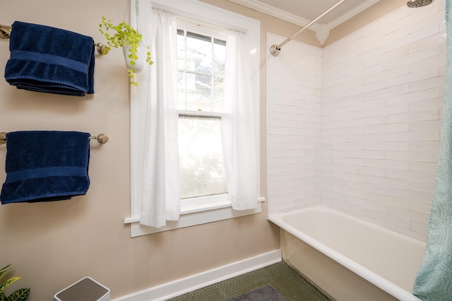 bathroom with baseboards, shower / bathtub combination with curtain, and crown molding