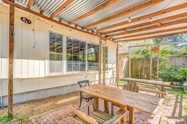 sunroom / solarium with outdoor dining space