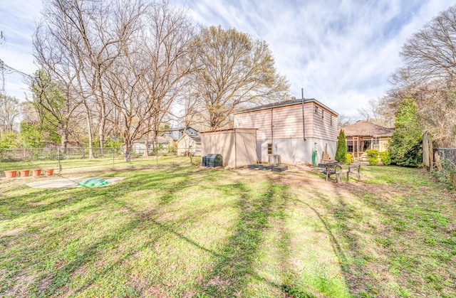 view of yard featuring an outbuilding and a fenced backyard
