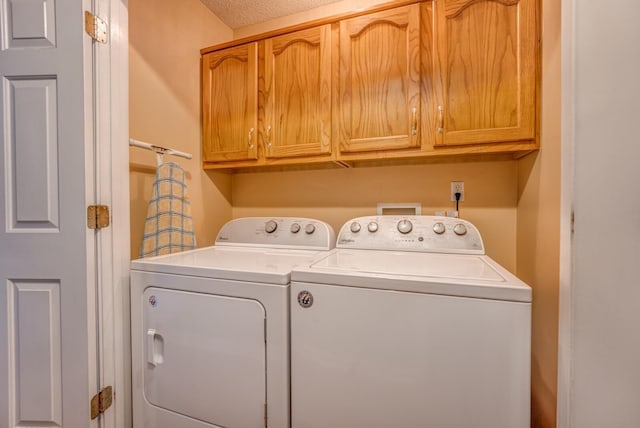 laundry area with cabinet space and washing machine and dryer