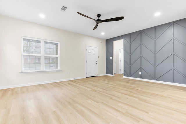unfurnished living room with visible vents, baseboards, recessed lighting, a ceiling fan, and light wood-style floors