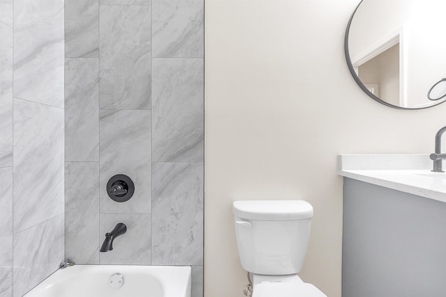 bathroom with toilet, shower / bathing tub combination, and vanity