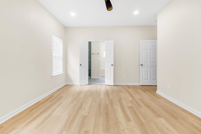 unfurnished bedroom featuring recessed lighting, baseboards, and light wood-type flooring
