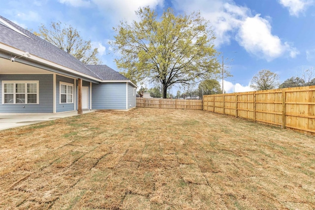view of yard with a fenced backyard and a patio area