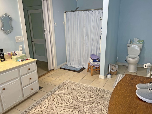 full bathroom with a shower with shower curtain, tile patterned flooring, and vanity