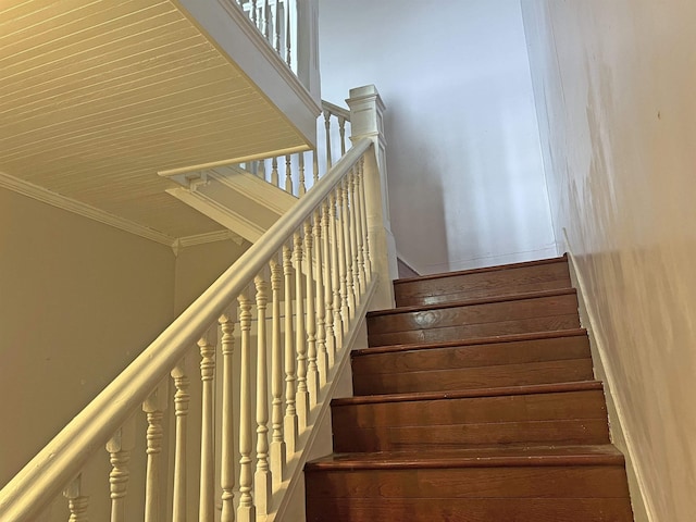 staircase with ornamental molding