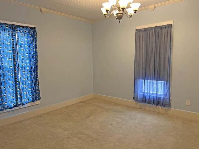empty room featuring baseboards, carpet floors, crown molding, and a notable chandelier