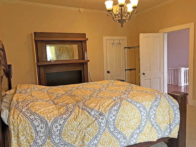 bedroom featuring an inviting chandelier, ornamental molding, and a closet
