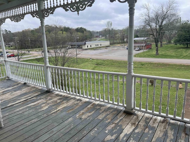 wooden terrace with a yard
