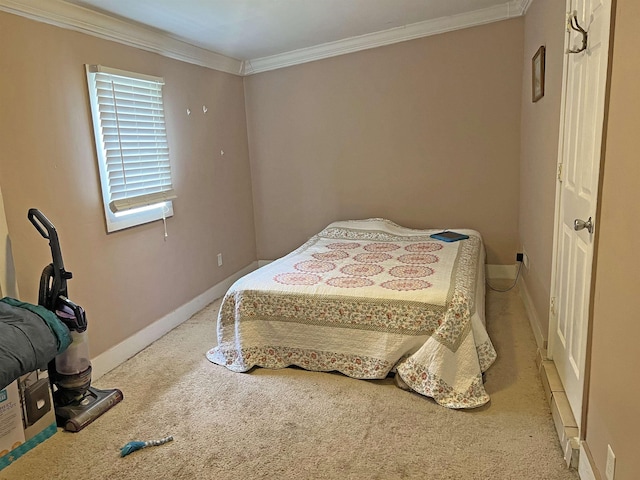 carpeted bedroom with baseboards and crown molding