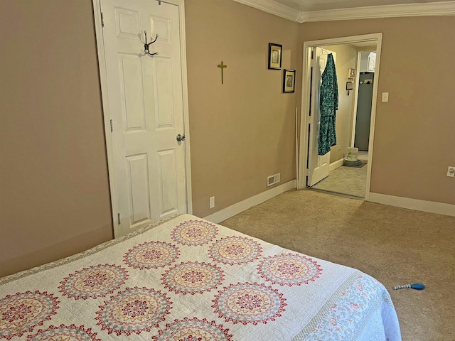 bedroom featuring fridge, crown molding, baseboards, carpet floors, and visible vents
