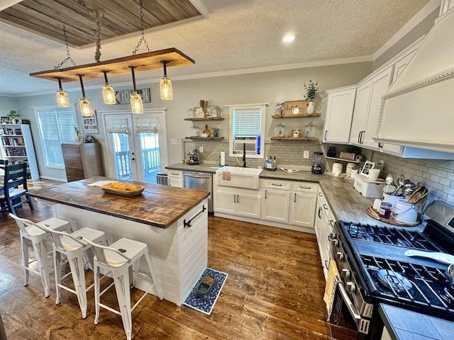 417 E Tigrett St, Halls, TN 38040 - kitchen with crown molding, open shelves, stainless steel appliances, a sink, and wood counters