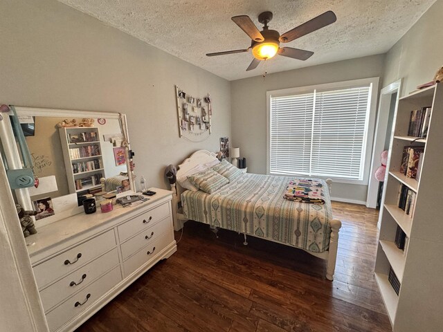 417 E Tigrett St, Halls, TN 38040 - bedroom featuring dark wood-type flooring, a textured ceiling, and ceiling fan