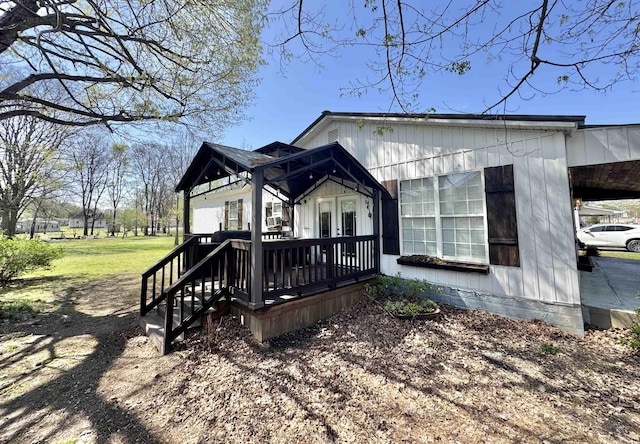 417 E Tigrett St, Halls, TN 38040 - exterior space featuring french doors, a deck, and a carport